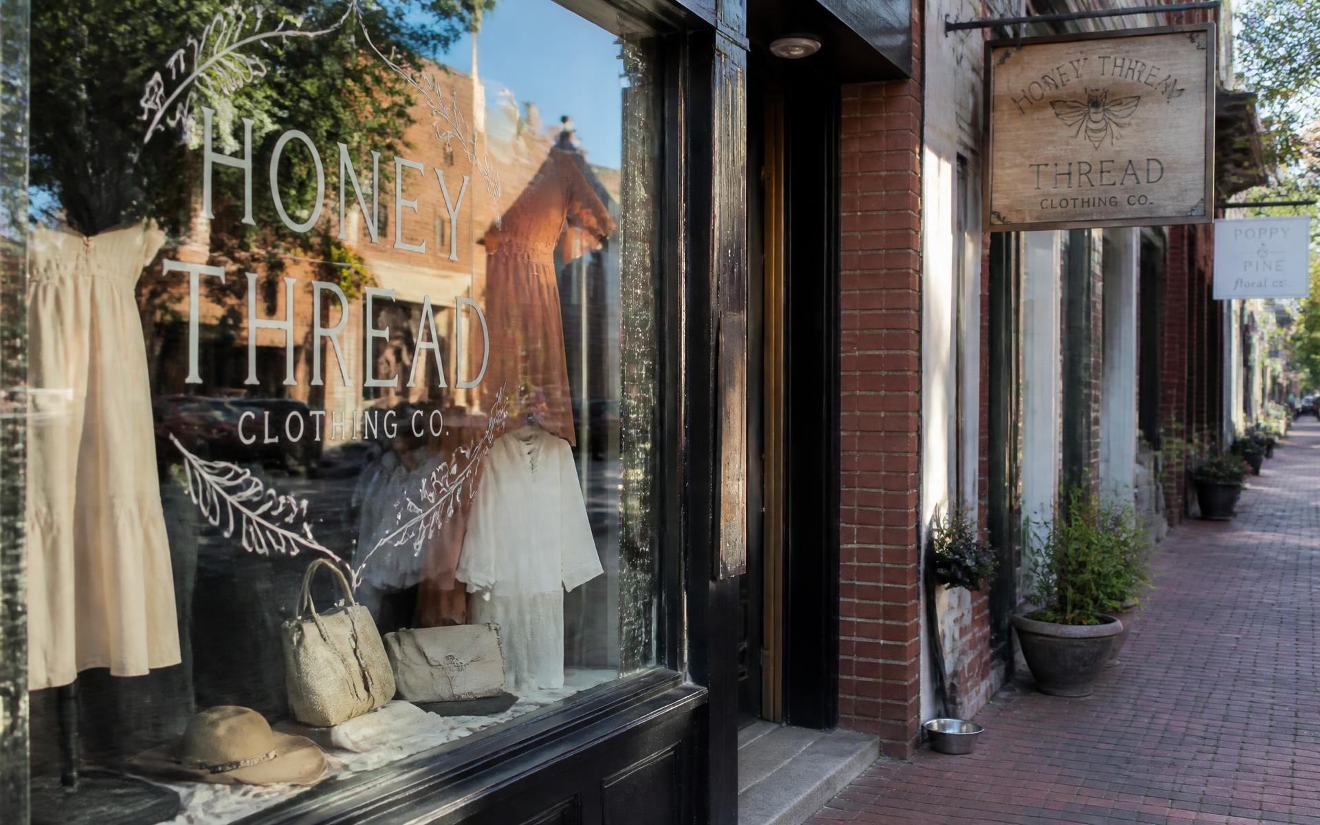 A boutique storefront window on a Dilworth shopping street